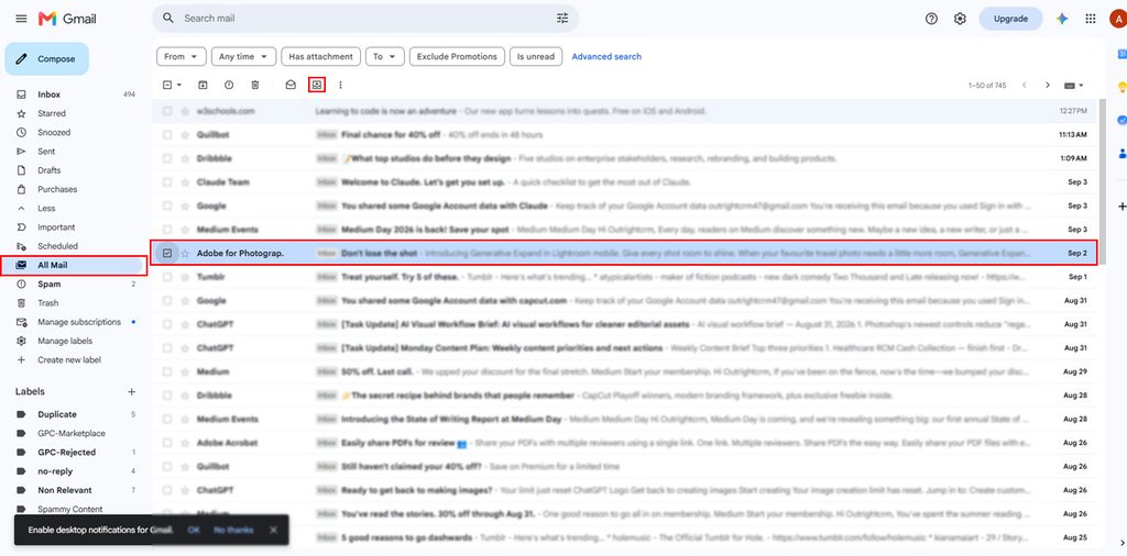 Hover over the email and click the Move to Inbox icon